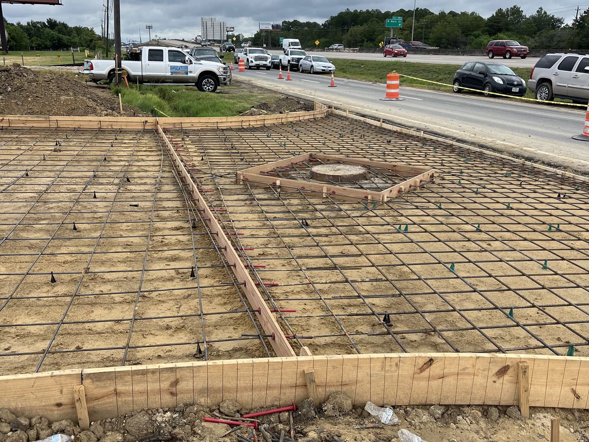 Rebar grid staked out and tied before a concrete pour