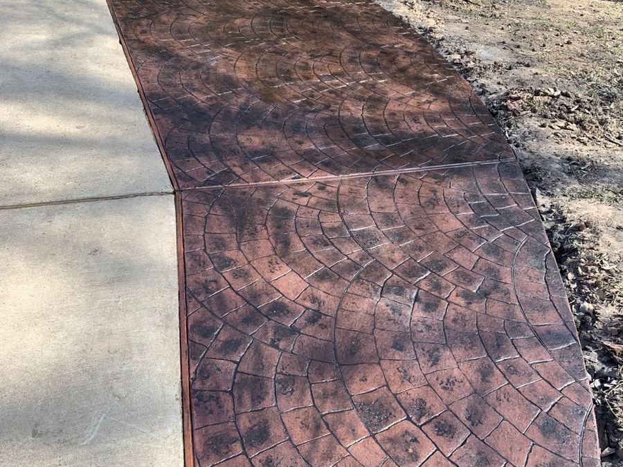 Stamped decorative concrete walkway with a patterned finish