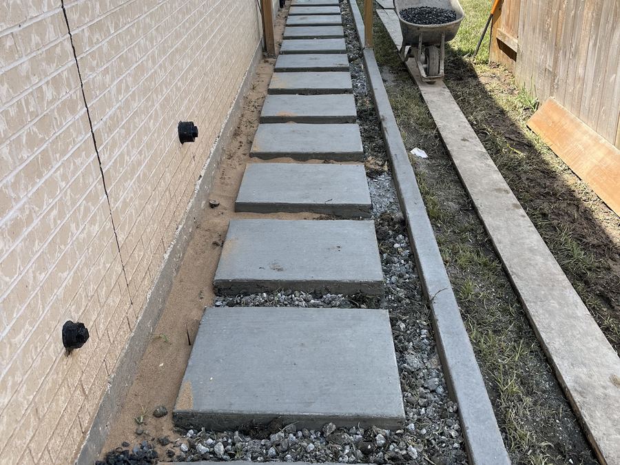 Concrete paver walkway with gravel inlay under construction